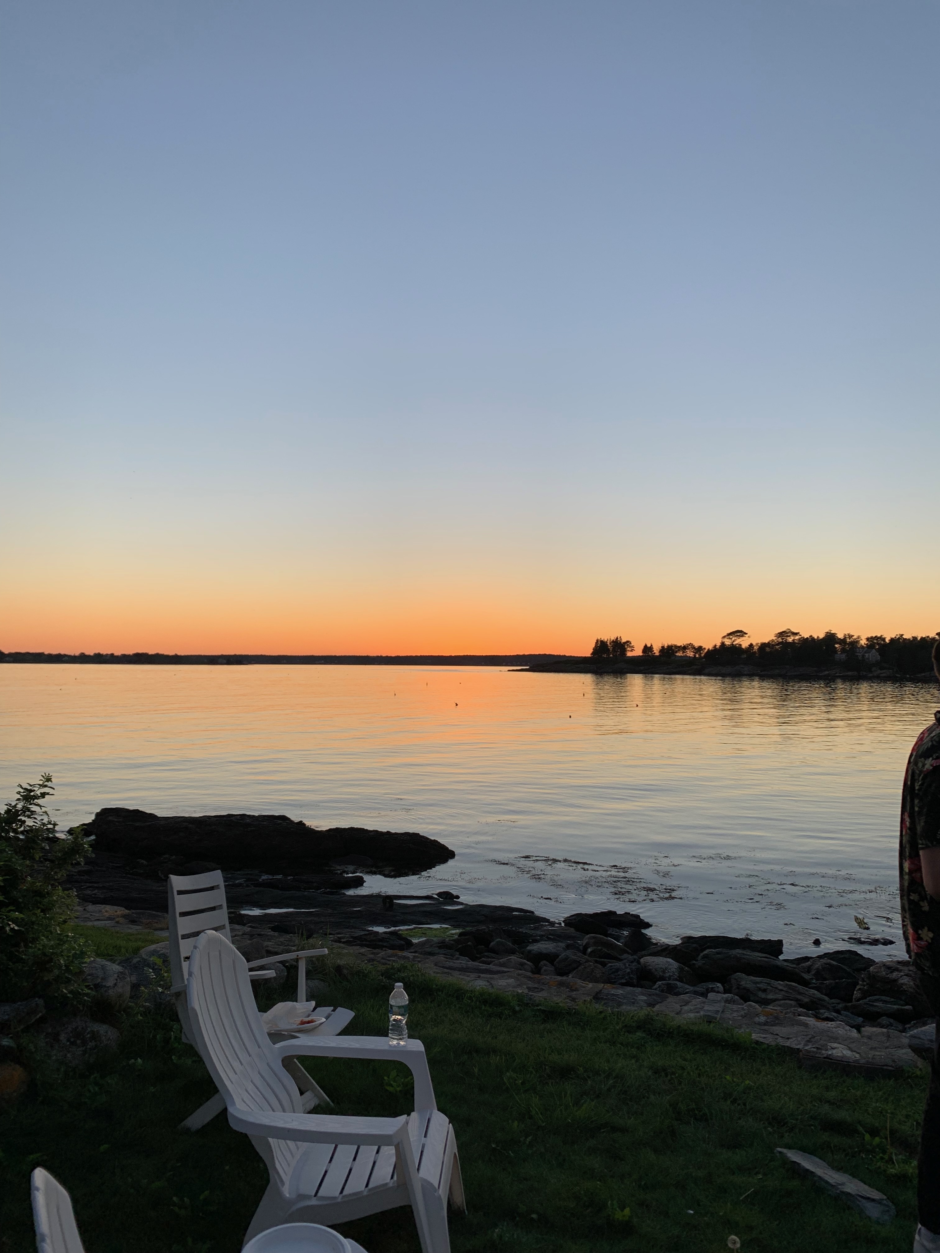 Adirondack chairs at sunset